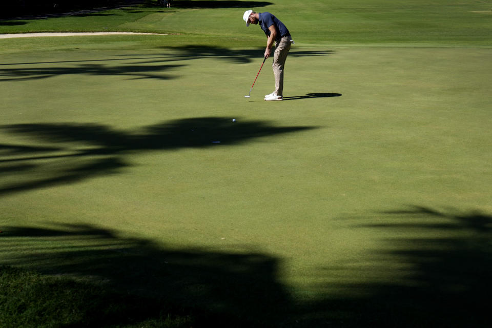 Chris Kirk putts on the ninth green during the first round of the Sony Open golf tournament, Thursday, Jan. 12, 2023, at Waialae Country Club in Honolulu. (AP Photo/Matt York)