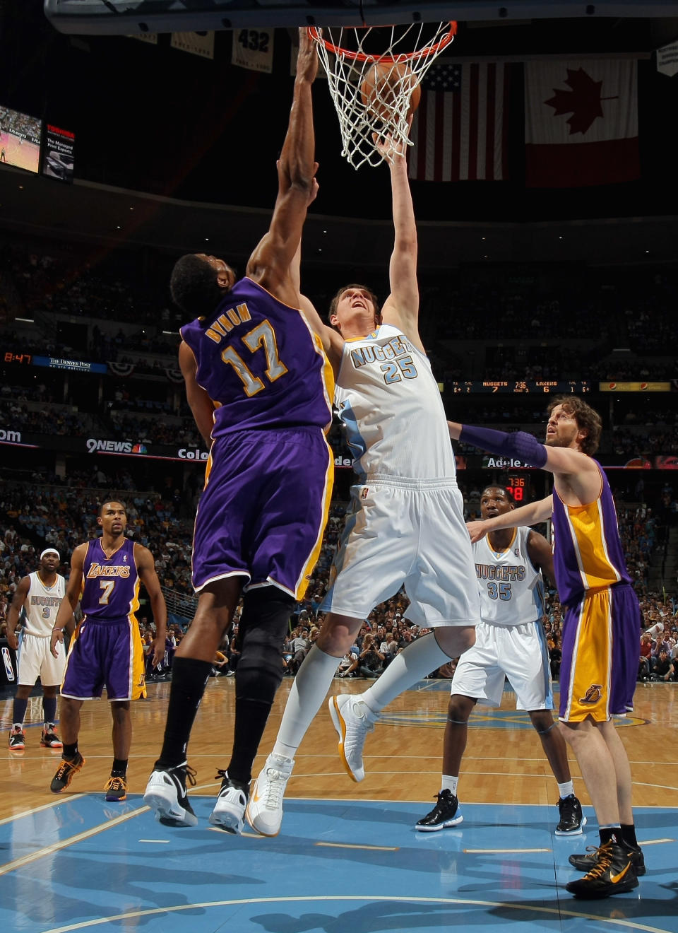 DENVER, CO - MAY 04: Andrew Bynum #17 of the Los Angeles Lakers blocks a shot by Timofey Mozgov #25 of the Denver Nuggets in Game Three of the Western Conference Quarterfinals in the 2012 NBA Playoffs at Pepsi Center on May 4, 2012 in Denver, Colorado. NOTE TO USER: User expressly acknowledges and agrees that, by downloading and or using this photograph, User is consenting to the terms and conditions of the Getty Images License Agreement. (Photo by Doug Pensinger/Getty Images)