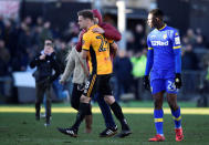 Soccer Football - FA Cup Third Round - Newport County AFC vs Leeds United - Rodney Parade, Newport, Britain - January 7, 2018 Newport County's Mickey Demetriou celebrates while Leeds United's Hadi Sacko looks on after the match REUTERS/Rebecca Naden