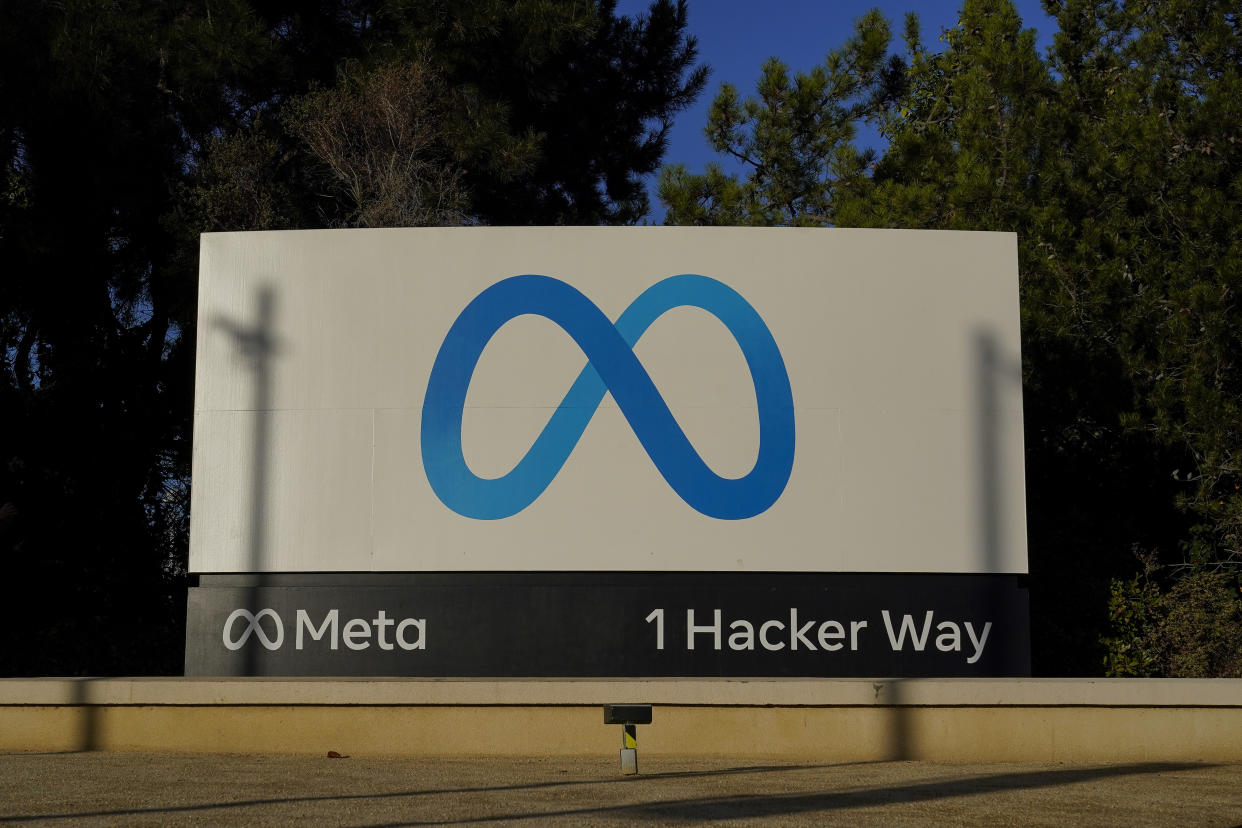 Meta's logo can be seen on a sign at the company's headquarters in Menlo Park, Calif., Wednesday, Nov. 9, 2022. Meta, which is Facebook's parent company, is laying off 11,000 people, about 13% of its workforce, as it contends with faltering revenue and broader tech industry woes, CEO Mark Zuckerberg said in a letter to employees Wednesday. (AP Photo/Godofredo A. Vásquez)