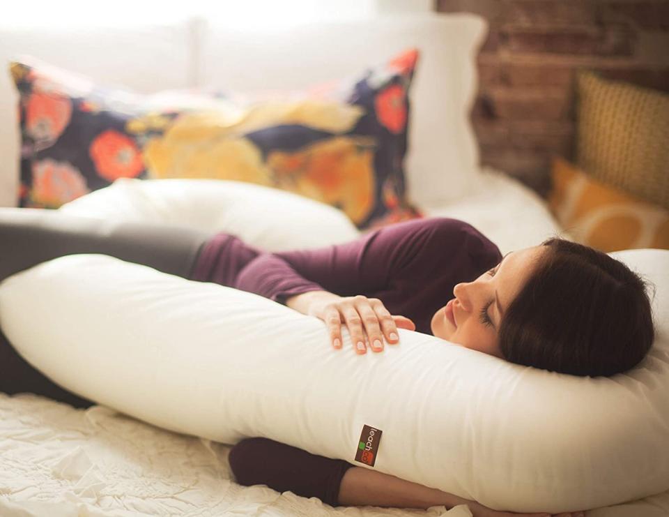 Yes, it's meant for pregnant people but if you're a cuddler, this is a great alternative to using an actual human who gets all hot and needs to move and then bother you.<br /><br /><strong>Promising review:</strong> "I was really miserable from the beginning to the end of my pregnancy. This pillow was literally the only thing that made me comfortable. I even brought it with me to the hospital when I got induced. This pillow is probably what allowed me to keep working up until the day I had her because I couldn't get any sleep without it. One of the great things about it is it stays cool, so if you're super hot all the time like I was you won't have to keep adjusting it to the cooler parts. Now that my daughter is here I've used the end of it like a boppy and it works great (particularly for night feedings). I also still like to sleep with it. I would absolutely buy it again." &mdash; <a href="https://www.amazon.com/gp/customer-reviews/R1EIDNWY3YCGU3?&amp;linkCode=ll2&amp;tag=huffpost-bfsyndication-20&amp;linkId=7c125d5b333c6bb37e629a3bb4796c4f&amp;language=en_US&amp;ref_=as_li_ss_tl" target="_blank" rel="noopener noreferrer">KatieTop</a><br /><br /><strong><a href="https://www.amazon.com/dp/B0000635WI?&amp;linkCode=ll1&amp;tag=huffpost-bfsyndication-20&amp;linkId=8cc7359227dae65a6f2da14694d467c2&amp;language=en_US&amp;ref_=as_li_ss_tl" target="_blank" rel="noopener noreferrer">Get it from Amazon for $57.99+ (available in three colors).</a></strong>