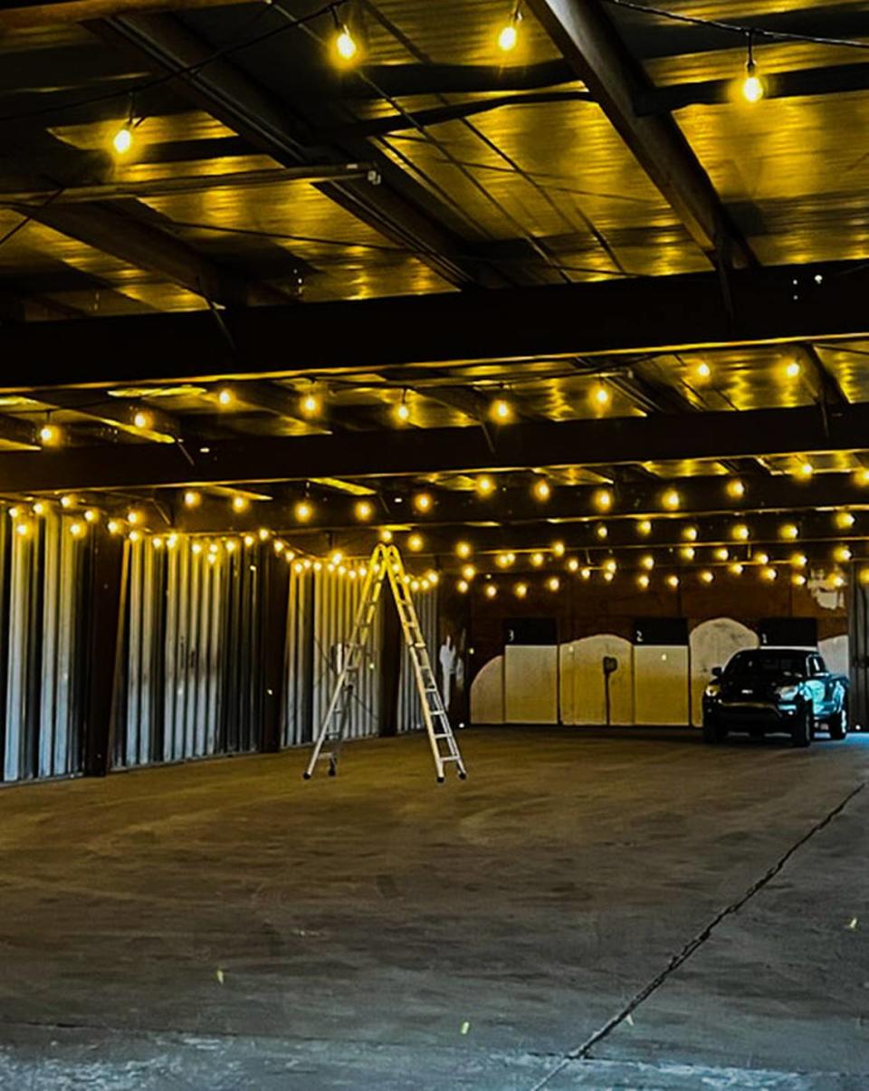 Workers prepare an old warehouse that’s being transformed into a manger at the Port of Port Royal.