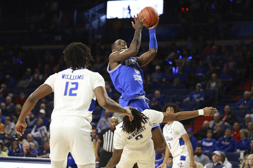 Tulsa guard Jesaiah McWright (0) draws a charge call against Memphis forward David Jones (8) during the first half of an NCAA college basketball game, Thursday, Jan. 4, 2024, in Tulsa, Okla. (AP Photo/Joey Johnson)