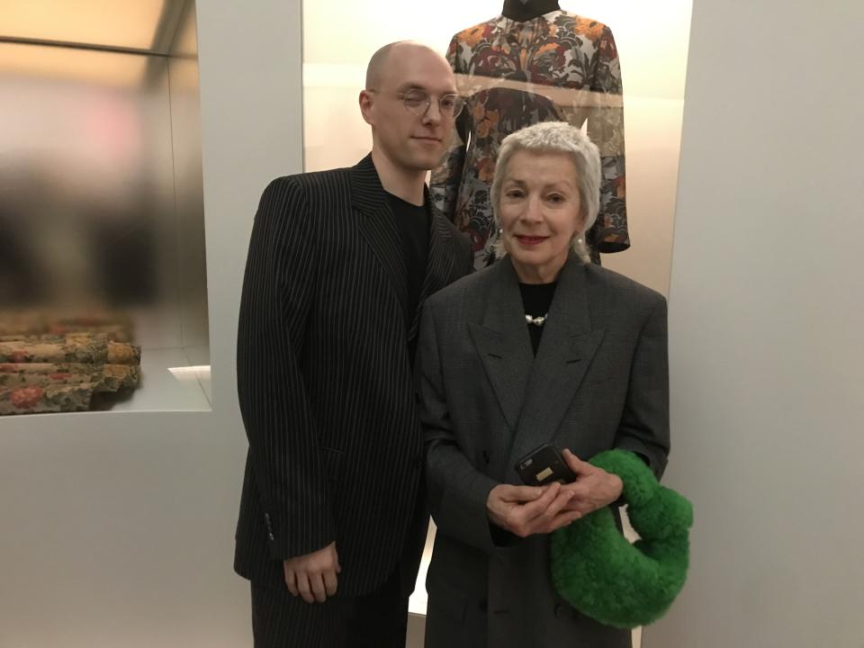 Felix Chabluk Smith and his mother in front of his 2013 design.
