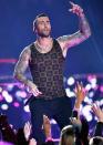 <p>Adam Levine's upper half is basically covered in tattoos, and there's one he wishes he didn't get. He told <a href="https://www.youtube.com/watch?v=ZyfiGwA9LgY" rel="nofollow noopener" target="_blank" data-ylk="slk:Anderson Cooper" class="link rapid-noclick-resp">Anderson Cooper</a> that it's a Russian prisoner-inspired tattoo on his right shoulder. He's tried to fix it, but he added that the result looks like "a cauliflower with a sun in the middle of it. It’s just despicable-looking."</p>