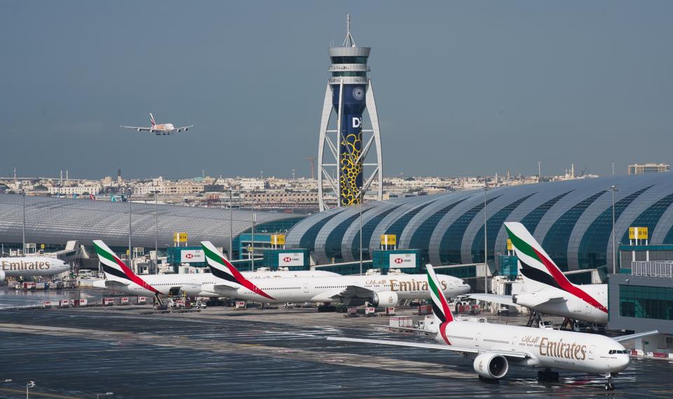 FILE - In this Dec. 11, 2019 file photo, an Emirates jetliner comes in for landing at Dubai International Airport in Dubai, United Arab Emirates. The airport is getting busier but it’s a long way from what it once was amid the coronavirus pandemic. To boost those numbers, airport CEO Paul Griffiths is urging countries to move away from mandatory quarantines on arriving passengers and toward the strategy embraced by Dubai. That includes aggressive coronavirus testing before departure, followed by mandatory mask-wearing on aircraft. (AP Photo/Jon Gambrell, File)