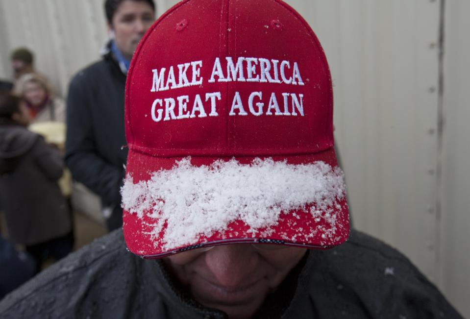 Snow collects on Dan Scheidel's hat as he waits to enter the DeltaPlex to hear President-elect Donald J. Trump to speak as part of his "USA Thank You Tour" in Walker, Mich., Friday, Dec. 9, 2016. Scheidel lives in Newaygo. Trump is thanking supporters in Grand Rapids, noting that the state helped power him to the White House. (Cory Morse/The Grand Rapids Press-MLive.com via AP)