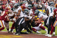 Philadelphia Eagles running back Boston Scott (35) scores a touchdown against the Washington Football Team during the first half of an NFL football game, Sunday, Jan. 2, 2022, in Landover, Md. (AP Photo/Alex Brandon)