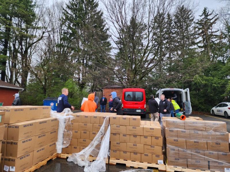 Salvation Army of Salem volunteers work to unload and sort a donation of food from The Church of Jesus Christ of Latter-Day Saints. The church donated 20,000 pounds of food to help alleviate food insecurity in Columbiana, Mahoning and other nearby counties.
