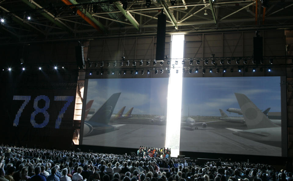 FILE - In this Sunday, July 8, 2007, file photo, hanger doors open to reveal the first production model of the new Boeing 787 at Boeing's assembly plant in Everett, Wash. The Boeing 787 was a plane that promised to be lighter and more technologically advanced than any other, but once production started, the gap between vision and reality quickly widened. The jet that was eventually dubbed the Dreamliner became plagued with manufacturing delays, cost overruns and sinking worker morale. (AP Photo/Ted S. Warren, File)