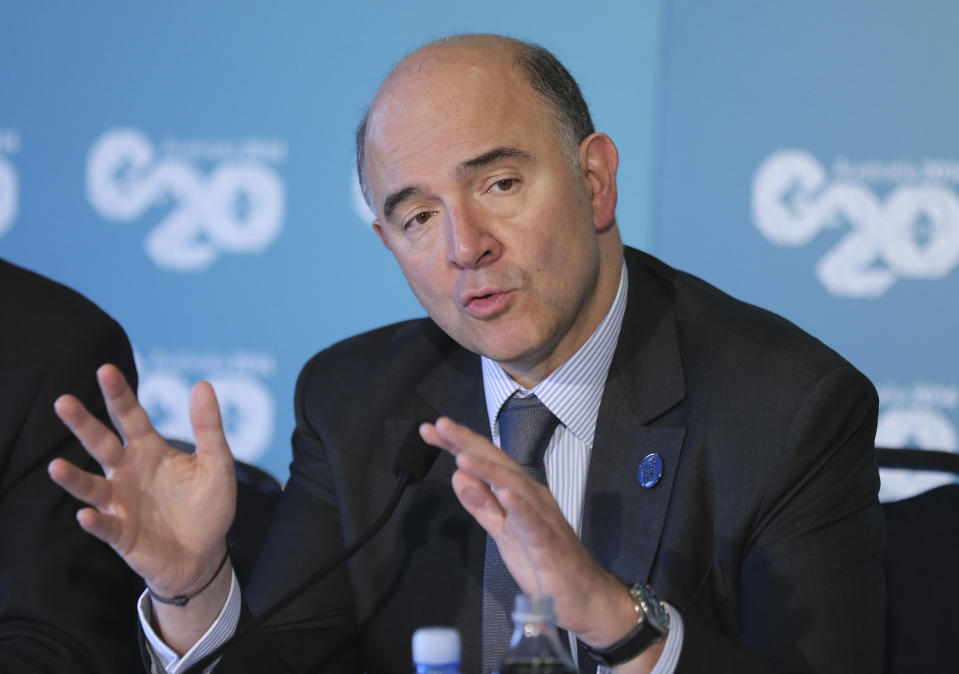 French Finance Minister Pierre Moscovici gestures as he delivers a closing statement to the media during a press conference at the G-20 Finance Ministers and Central Bank Governors meeting in Sydney, Australia, Sunday, Feb. 23, 2014.(AP Photo/Rob Griffith)