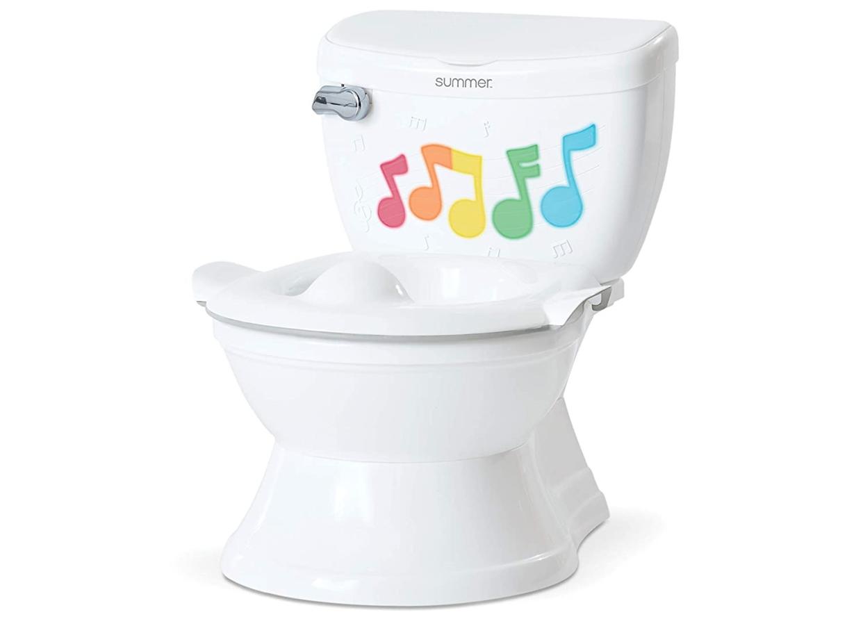 This musical training toilet comes in white and pink options. (Source: Amazon)