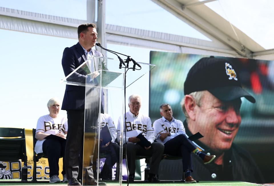 A photograph of Larry Miller is displayed as Steve Starks, chief executive officer and member of the board of directors of the Larry H. Miller Company, speaks at the celebration and groundbreaking event for the new Salt Lake Bees ballpark and Phase 1 of Downtown Daybreak in South Jordan on Thursday, Oct. 19, 2023. | Laura Seitz, Deseret News