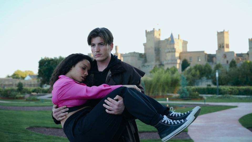 Kieron Moore carries Sisi Stringer in Vampire Academy 102