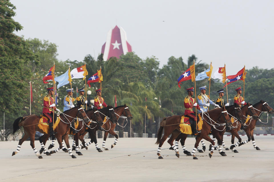 Myanmar's military demonstrates with horses during a parade to commemorate Myanmar's 78th Armed Forces Day in Naypyitaw, Myanmar, Monday, March 27, 2023. (AP Photo/Aung Shine Oo)