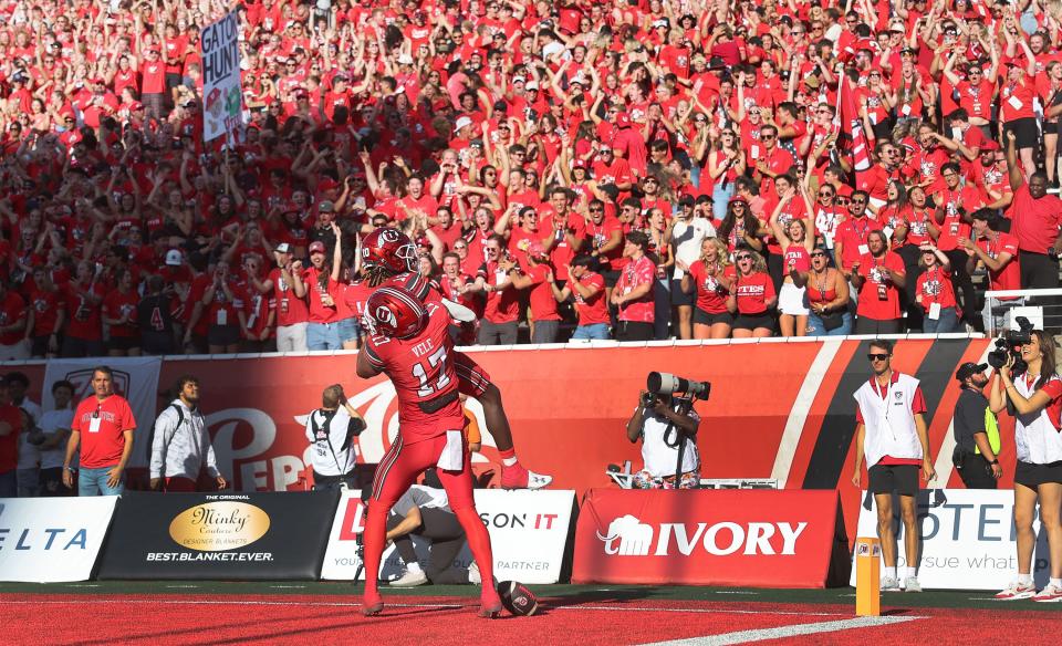 Utah Utes wide receiver Money Parks (10) celebrates his touchdown with Utah Utes wide receiver Devaughn Vele (17) on the Utes first offensive play in Salt Lake City on Thursday, Aug. 31, 2023 during the season opener. | Jeffrey D. Allred, Deseret News