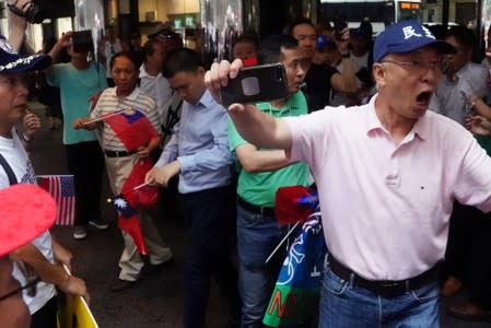 People engage in scuffles outside Grand Hyatt hotel, where Taiwan's President Tsai Ing-wen is supposed to stay during her visit to the U.S., in New York City