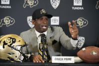 Deion Sanders speaks after being introduced as the new head NCAA college football coach at Colorado during a news conference Sunday, Dec. 4, 2022, in Boulder, Colo. (AP Photo/David Zalubowski)