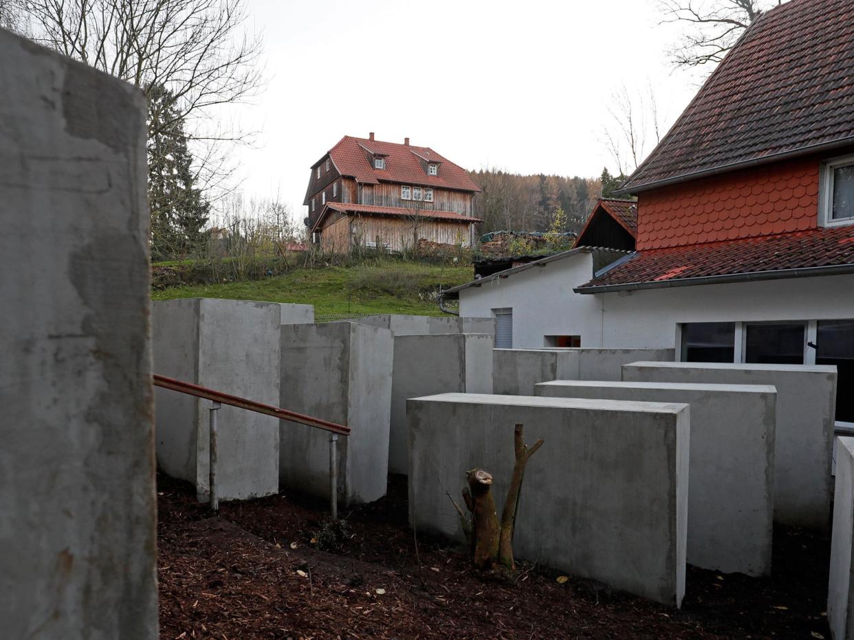 A replica of the Memorial to the Murdered Jews of Europe in Berlin, has been placed near a right wing politician's house (L): EPA