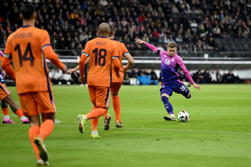 Germany's Maximilian Mittelstaedt (R) his side's first goal of the game during the International Friendly soccer match between Germany and Netherlands at the Deutsche Bank Park stadium. Arne Dedert/dpa