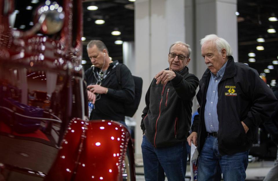 Eldie Troyer, left, and Ivan Fry, of Indiana, look at a classic hot rod inside Huntington Place for the 70th Annual Meguiar's Detroit Autorama car show in Detroit on Friday, Feb. 24, 2023.
