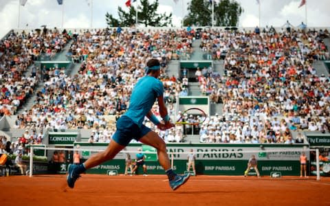 Spain's Rafael Nadal returns the ball to Argentina's Guido Pella during their men's singles second round match on day five of The Roland Garros 2018 French Open tennis tournament in Paris on May 31, 2018 - Credit: AFP