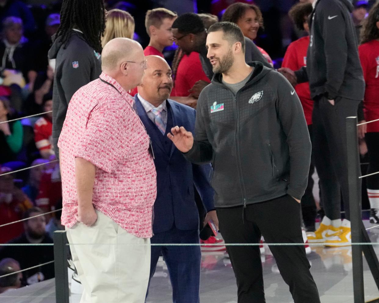 Kansas City Chiefs head coach Andy Reid (left) and Philadelphia Eagles head coach Nick Sirriani chat on stage during Super Bowl Opening Night on Feb. 6, 2023, at the Footprint Center in downtown Phoenix.