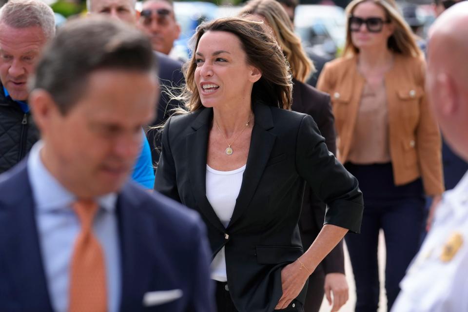 Karen Read, center, arrives at Norfolk Superior Court, Monday, July 1, 2024, in Dedham, Mass. Read is on trial, accused of killing her boyfriend Boston police Officer John O'Keefe, in 2022. The jury began deliberations in the trial Tuesday, June 25. (AP Photo/Steven Senne)