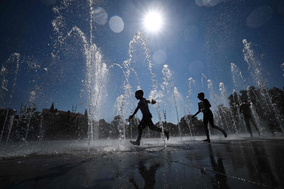 August 21, 2023: Children cool off as they run through a public fountain in Colmar as France experiences a late summer heatwave. In the "hottest" episode of summer 2023 in France Météo-France has warned of an "intense and lasting" heat wave saying "we could reach temperature levels never before seen in France."