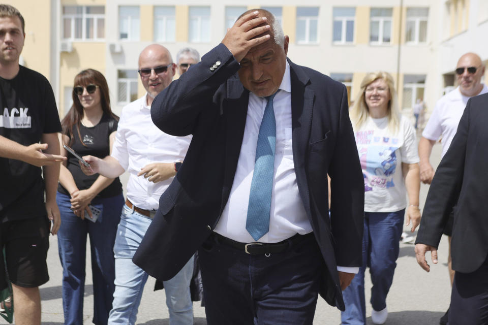 Bulgarian former Prime Minister Boyko Borissov walks after casting his vote at a polling station in Bankya, Sunday, June 9, 2024. Voters in Bulgaria are going to the polls on Sunday in national and European Parliament elections that have been overshadowed by political instability, economic inequality and growing concern over the war in nearby Ukraine. (AP Photo/Valentina Petrova)