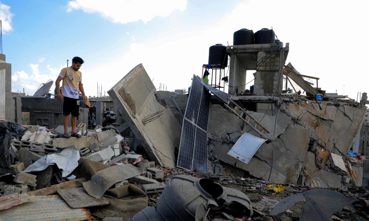 <span>A man stands on the rubble after an Israeli airstrike in the southern Gaza Strip city of Rafah.</span><span>Photograph: Xinhua/Rex/Shutterstock</span>