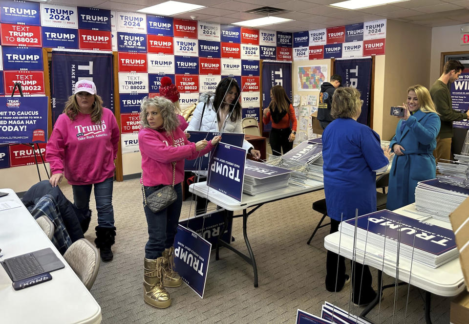 Volunteers work at former president Donald Trump's campaign headquarters in the closing days ahead of the GOP Iowa caucus on Saturday, Jan. 13, 2024, in Urbandale, Iowa. (AP Photo/Jill Colvin)