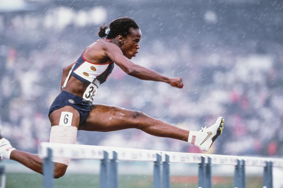 ATLANTA - JULY 27:  Jackie Joyner-Kersee of the USA runs the 100 meter hurdle race of the Heptathlon event of 1996 Summer Olympics on July 27, 1996 in the Centennial Olympic Stadium in Atlanta, Georgia.  (Photo by David Madison/Getty Images)