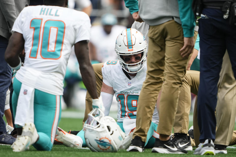 Miami Dolphins quarterback Skylar Thompson (19) is evaluated on the field after a play during the second half of an NFL football game against the Seattle Seahawks, Sunday, Sept. 22, 2024, in Seattle. (AP Photo/Lindsey Wasson)