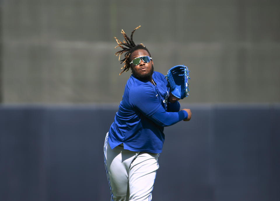 Toronto Blue Jays' Vladimir Guerrero Jr. warms up for the team's spring training baseball game game against the New York Yankees in Tampa, Fla., Wednesday, March 30, 2022. (Mark Taylor/The Canadian Press via AP)