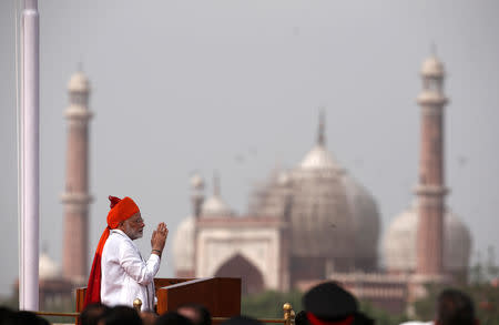 Prime Minister Narendra Modi greets the crowd before addressing the nation during Independence Day celebrations at the historic Red Fort in Delhi, August 15, 2018. REUTERS/Adnan Abidi