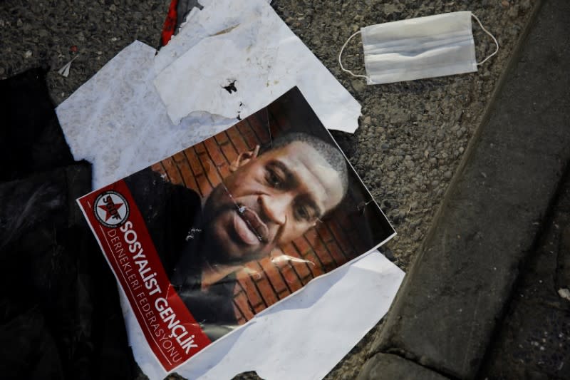 A portrait of George Floyd lies on the ground after a scuffle during a protest in Istanbul