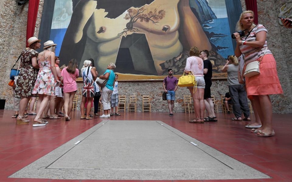 Tourists visit the tomb of Salvador Dali at the Teatre-Museu Dali (Theatre-Museum Dali) following the exhumation  - Credit: LLUIS GENE/AFP