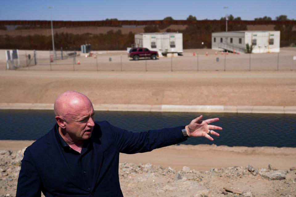 U.S. Sen. Mark Kelly speaks to the media about the barrier gaps at Morelos Dam on Aug. 10, 2022, in Yuma.