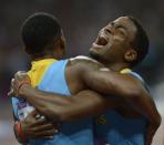 Bahamas' Michael Mathieu (R) and Demetrius Pinder celebrate after winning gold in the men's 4 x 400m relay final at the athletics event of the London 2012 Olympic Games on August 10, 2012 in London