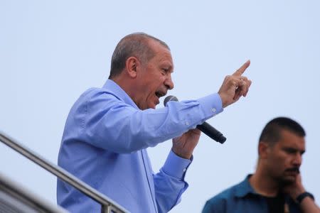 Turkish President Tayyip Erdogan gestures as he adresses supporters during a rally in Istanbul, Turkey June 22, 2018. REUTERS/Alkis Konstantinidis