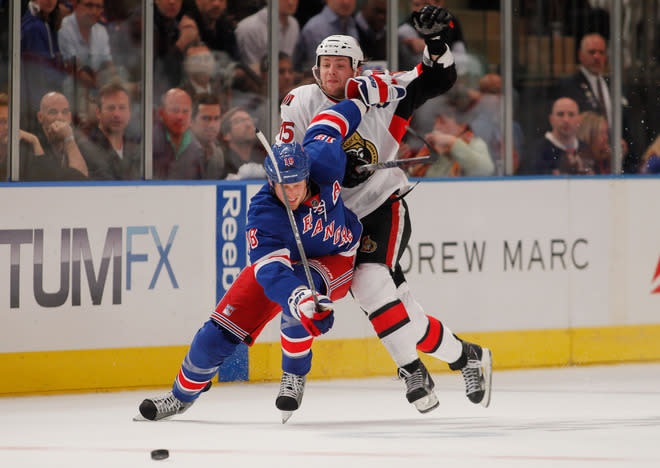   Marc Staal #18 Of The New York Rangers Fights For The Puck Against Zack Smith #15 Of The Ottawa Senators In Game Five Getty Images