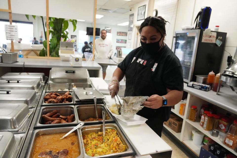 An employee readies a meal at Pacific Seas Restaurant in Salt Lake City.