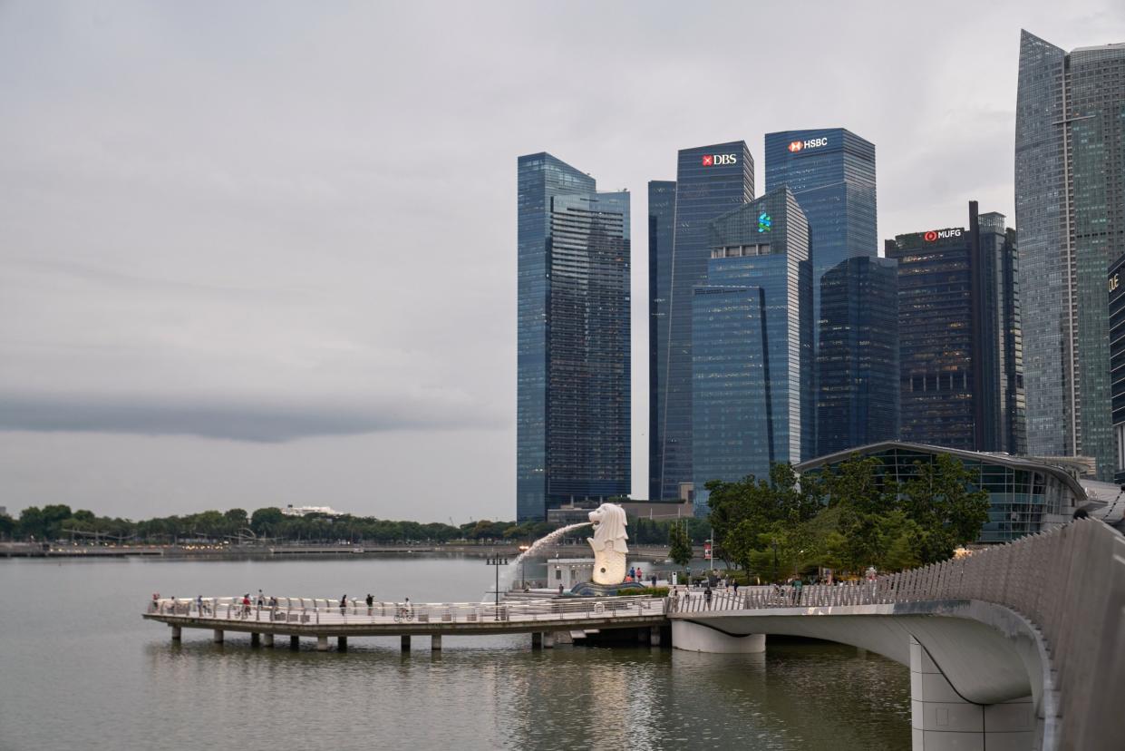 People at Merlion Park in the central business district of Singapore, on Wednesday, May 19, 2021. Photographer: Lauryn Ishak/Bloomberg