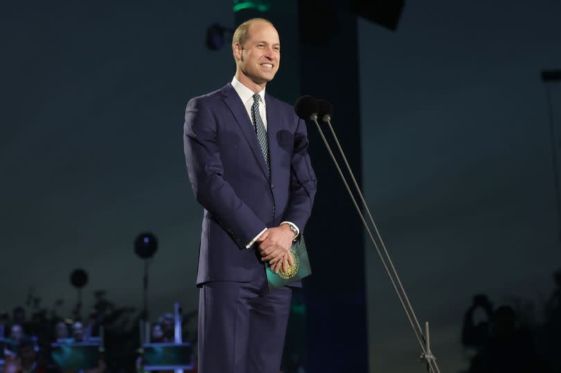 Prince William smiling on stage at King Charles's Coronation Concert