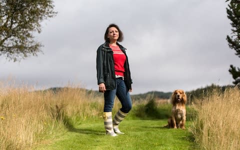 Flic Everett and her spaniel, Ellroy: she has found that daily walks in the West Highlands have lessened her anxiety - Credit: Robert Ormerod