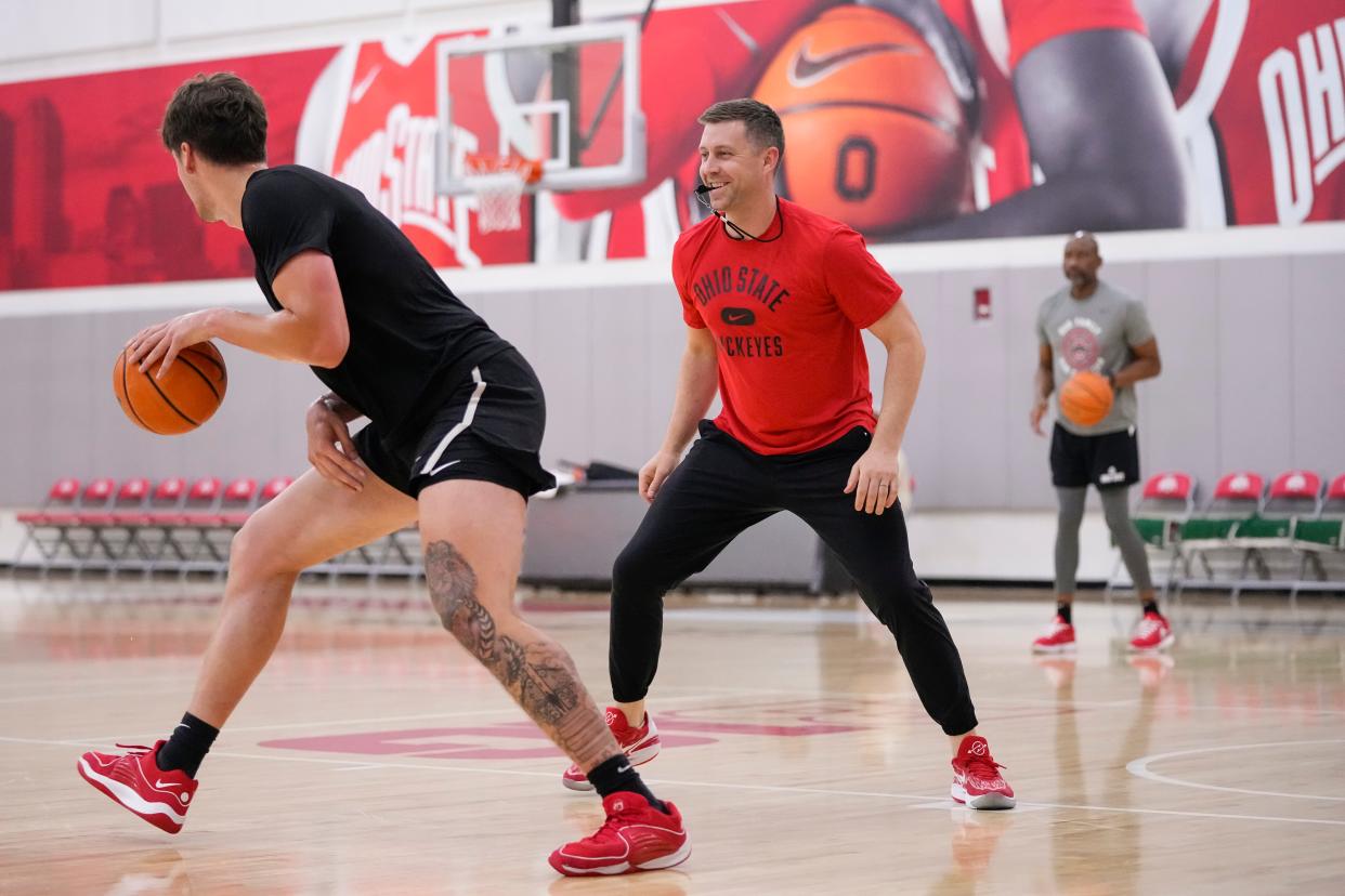 Jul 9, 2024; Columbus, OH, USA; Ohio State Buckeyes head coach Jake Diebler guards center Austin Parks during a summer workout in the practice gym at the Schottenstein Center.