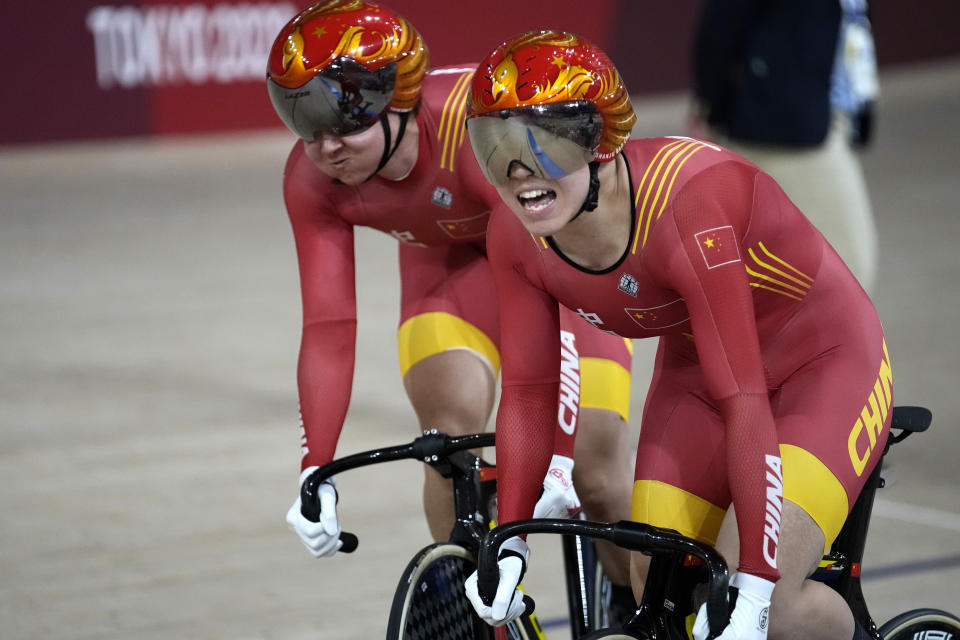 Shanju Bao, right, and Tianshi Zhong of Team China compete during the track cycling women's team sprint finals at the 2020 Summer Olympics, Monday, Aug. 2, 2021, in Izu, Japan. (AP Photo/Christophe Ena)