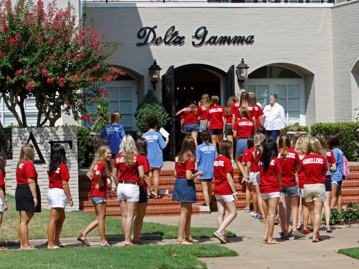 Students line up for a visit to the Delta Gamma sorority house during recruitment week at the University of Oklahoma on Aug. 12, 2011, in Norman.