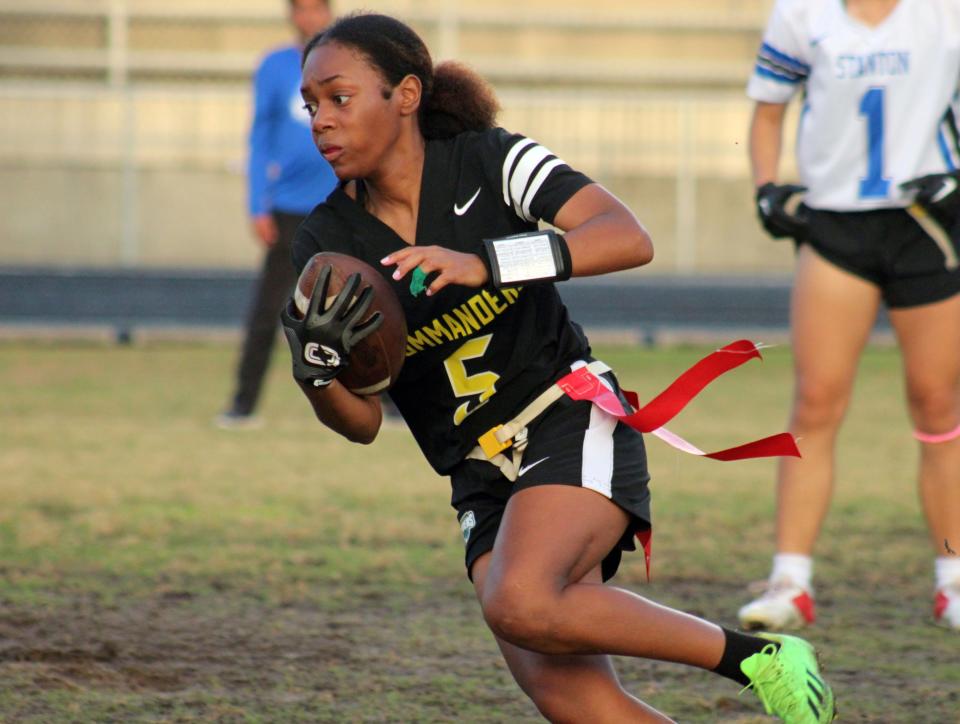 Ed White's Tyra Pierce (5) runs in the open field during the Gateway Conference high school flag football championship against Stanton.